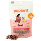 A bag of Pupford Train Dog Training Freeze-Dried Beef Liver treats, shown with a small pile of the brown kibble pieces in front on a white background.
